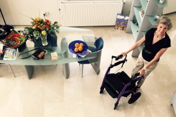 Woman using mobility aid inside the house