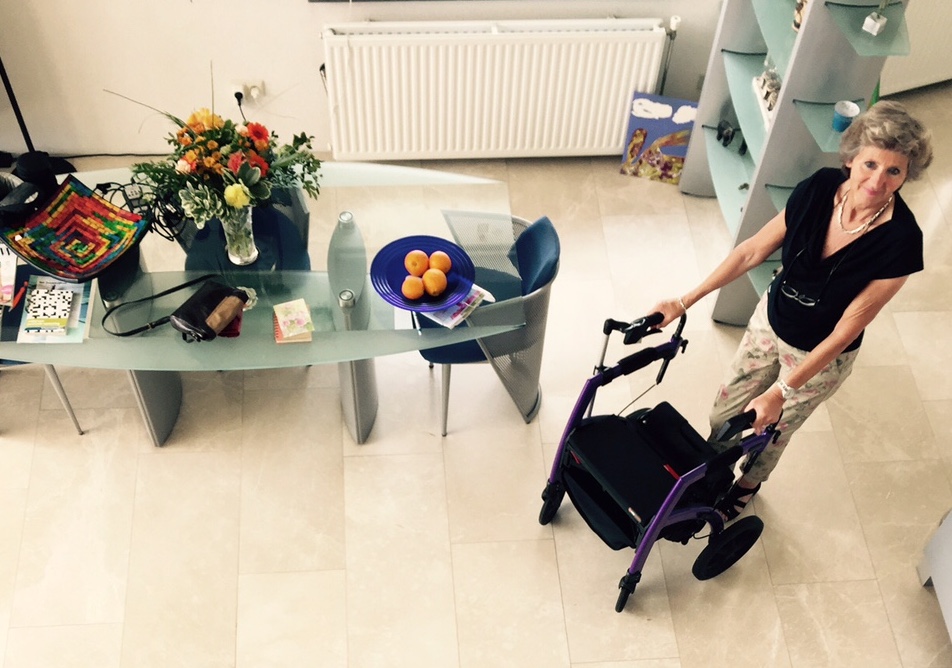 Woman using mobility aid inside the house