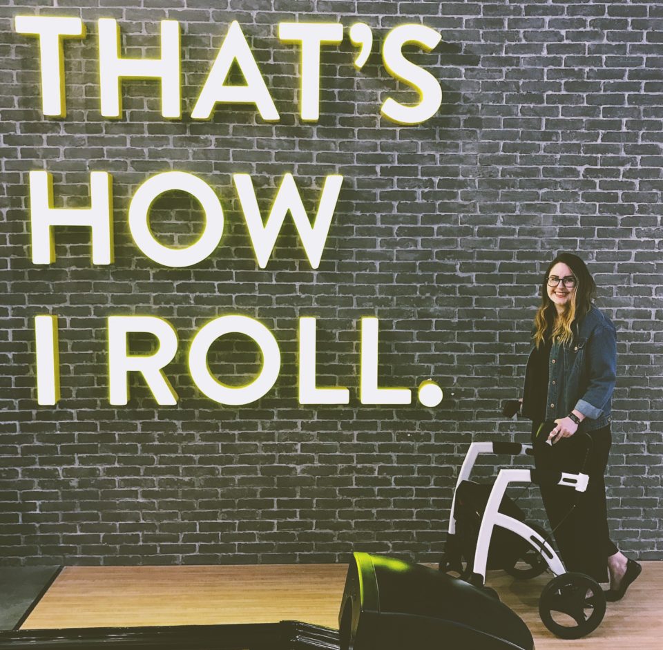 Woman with EDS using a rollator wheelchair