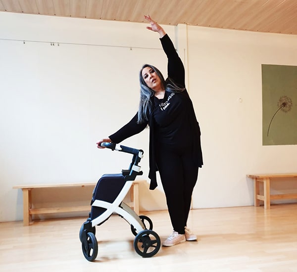 Woman dancing with a Rollz Flex lightweight rollator