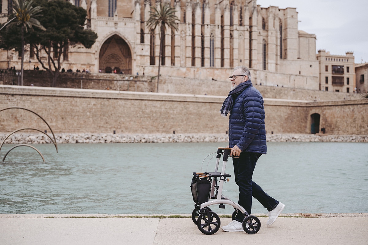 Man walking with a Saljol Allround Rollator