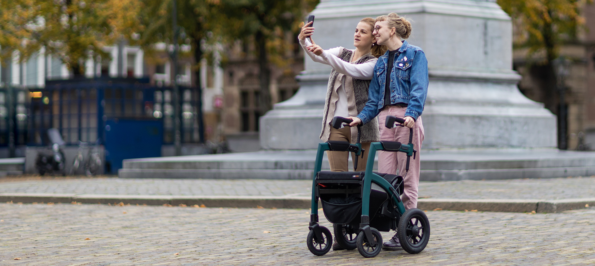 Young girl living with a chronical disease walks with a Rollz Motion Performance rollator to review it