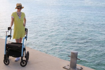 Woman with multiple sclerosis enjoying a day out with a Rollz Motion rollator