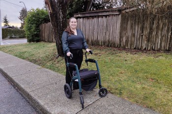 Woman using a mobility aid for going to school