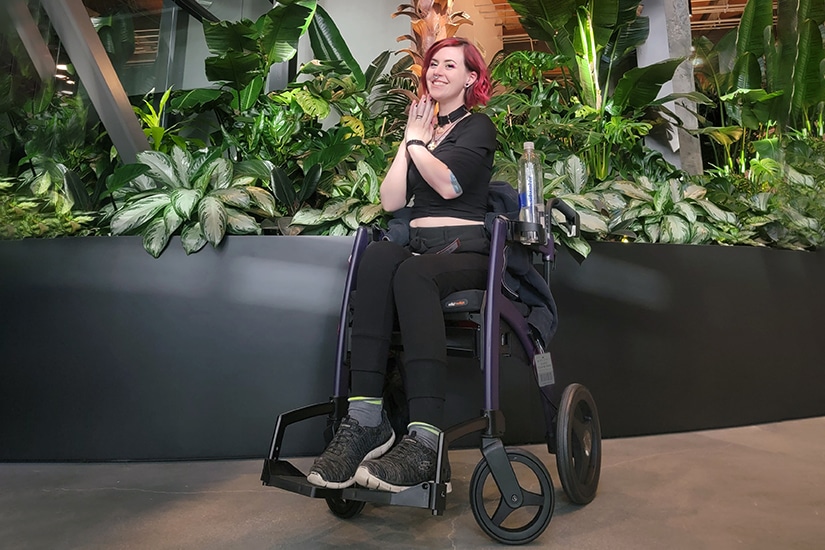 Disabled hair stylist sitting in a Rollz Motion wheelchair