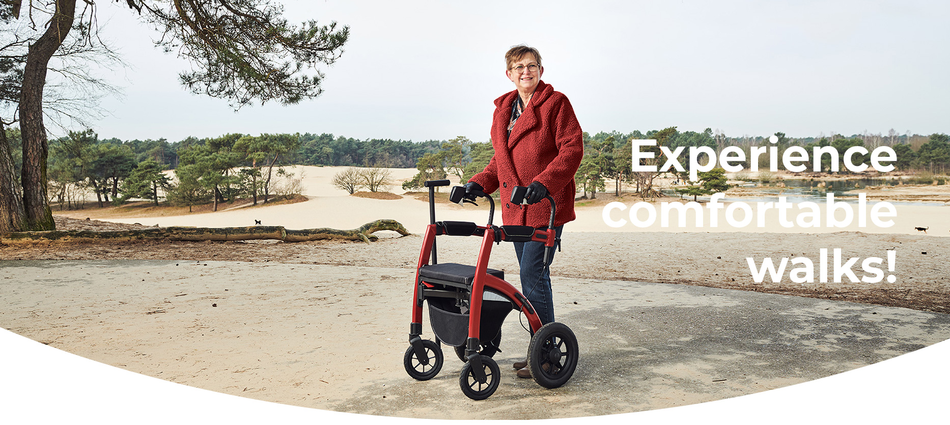Woman walking with an all terrain rollator walker