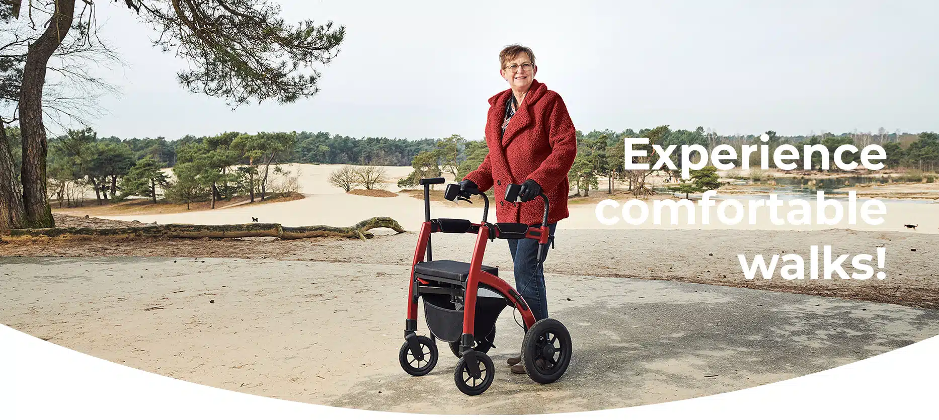 Woman walking with an all terrain rollator walker