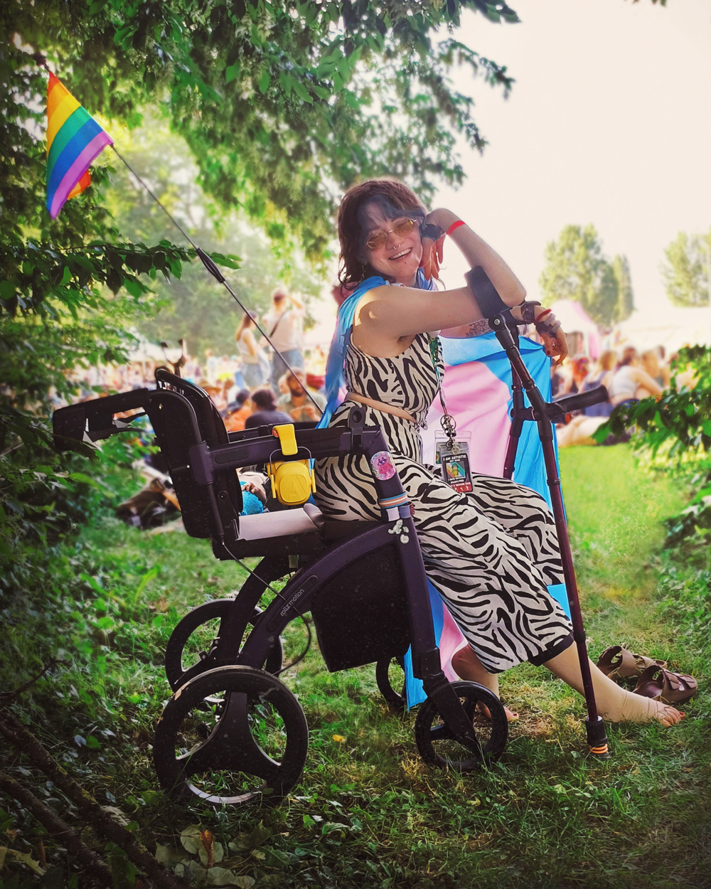 Girl sitting in a wheelchair and raising awareness on Disability Pride Month