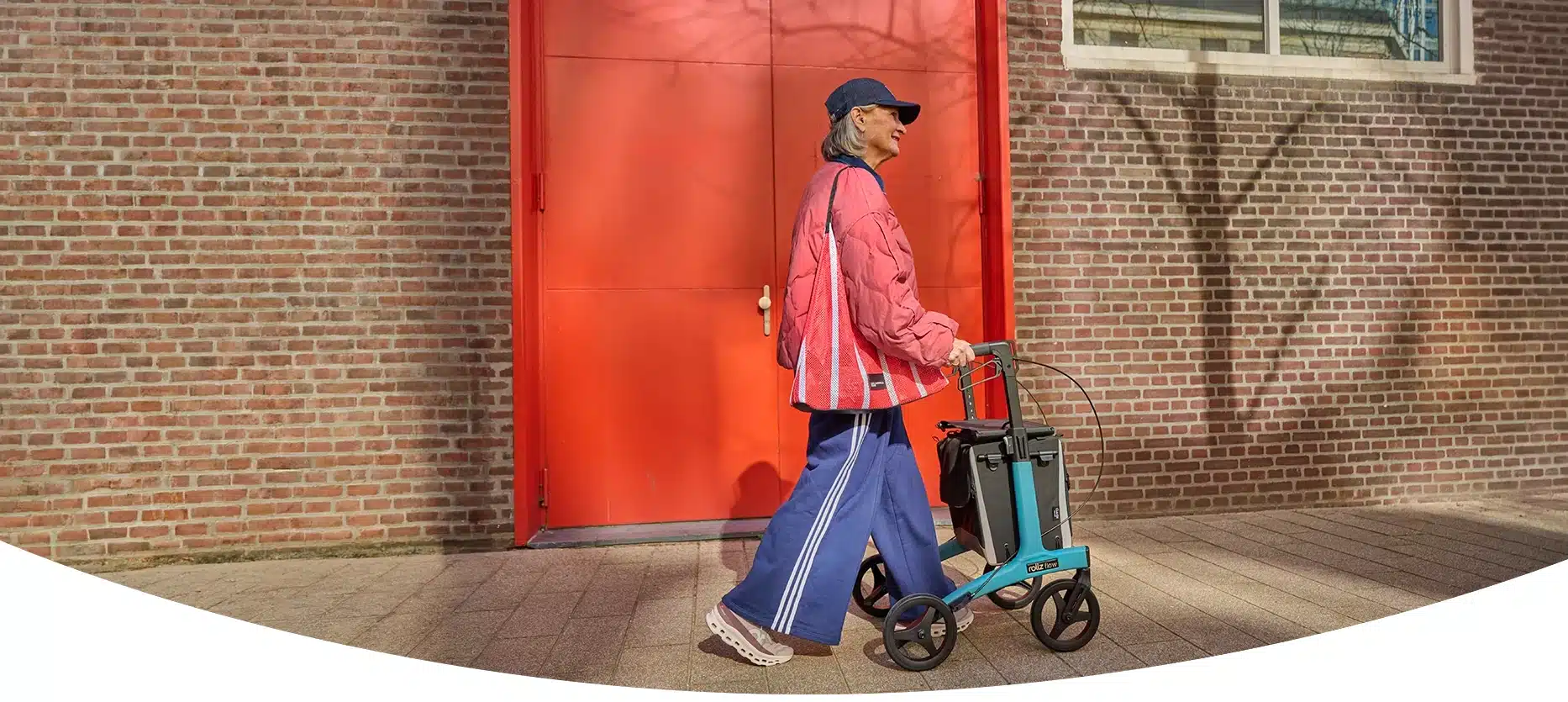 Woman walking with a modern aluminium rollator